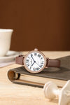 London Fog Analog Quartz Watch for Women with White Round Dial, Roman Numeral Hour Markers, Crystal-Studded Bezel and Brown Leather Strap - LFW20007-04
