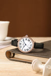 London Fog Analog Quartz Watch for Women with White Round Dial, Roman Numeral Hour Markers, Crystal-Studded Bezel and Black Leather Strap - LFW20007-03